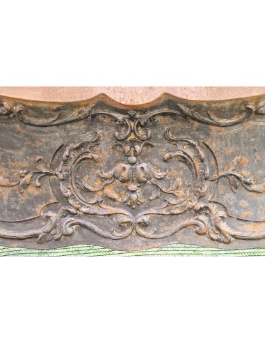 Large baroque cast iron insert, artistically crafted, that can be adapted to fit the mantel of a marble fireplace.