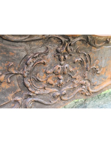 Large baroque cast iron insert, artistically crafted, that can be adapted to fit the mantel of a marble fireplace.