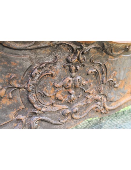 Large baroque cast iron insert, artistically crafted, that can be adapted to fit the mantel of a marble fireplace.