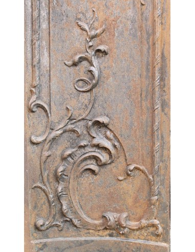 Large baroque cast iron insert, artistically crafted, that can be adapted to fit the mantel of a marble fireplace.