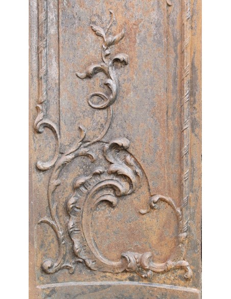 Large baroque cast iron insert, artistically crafted, that can be adapted to fit the mantel of a marble fireplace.