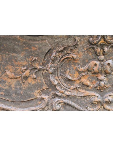 Large baroque cast iron insert, artistically crafted, that can be adapted to fit the mantel of a marble fireplace.