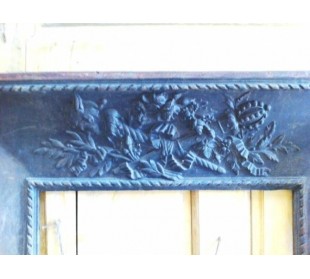 Antique cast iron insert, artistically crafted, designed to fit the opening of a marble fireplace mantel. 2
