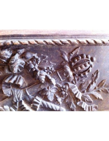 Antique cast iron insert, artistically crafted, designed to fit the opening of a marble fireplace mantel.