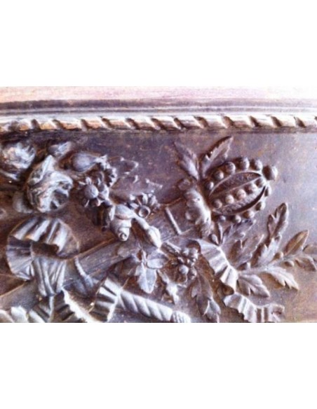 Antique cast iron insert, artistically crafted, designed to fit the opening of a marble fireplace mantel.