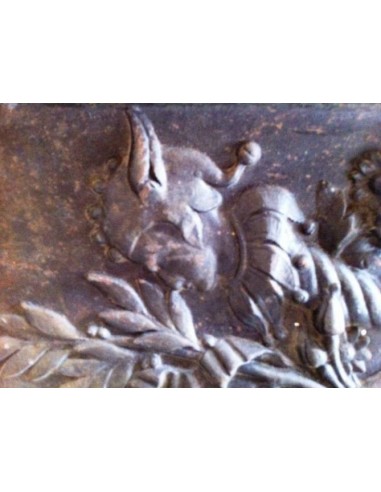 Antique cast iron insert, artistically crafted, designed to fit the opening of a marble fireplace mantel.