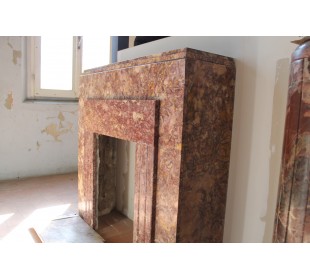 Antique Art Deco style fireplace carved in Brocatello marble, a marble that is quite rare today.