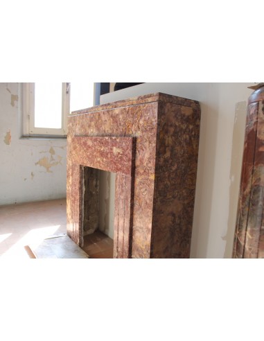 Antique Art Deco style fireplace carved in Brocatello marble, a marble that is quite rare today.
