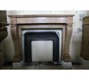 Antique Empire-style fireplace mantel, known as "Lion's Paws" carved in yellow floral marble and coming from Paris.