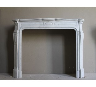 ANTIQUE LOUIS XV "PIED GALBÉ TRANSITION" FIREPLACE MANTEL CARVED IN WHITE CARRARA MARBLE.