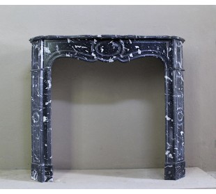 Antique Black Marquinia baroque fireplace mantel.