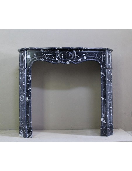 Antique Black Marquinia baroque fireplace mantel.