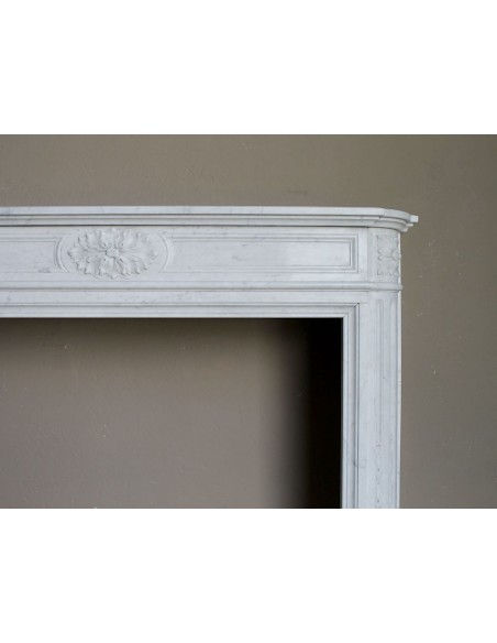 259 ANTIQUE LOUIS XVI "DÉMI-LUNE TROIS FLEURS" FIREPLACE MANTEL IN WHITE CARRARA MARBLE