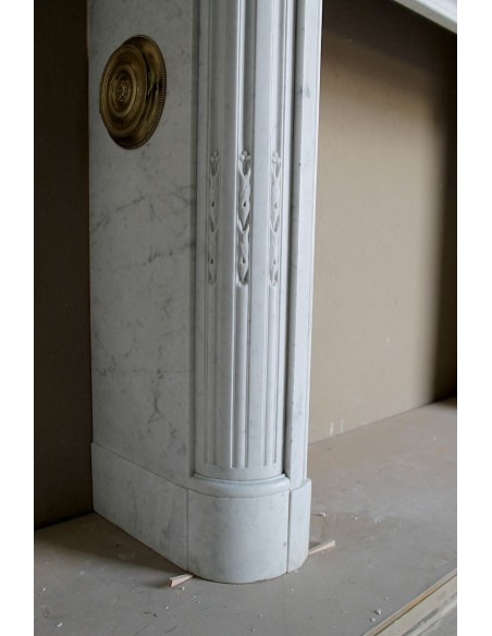 259 ANTIQUE LOUIS XVI "DÉMI-LUNE TROIS FLEURS" FIREPLACE MANTEL IN WHITE CARRARA MARBLE