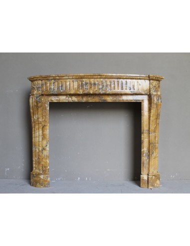 Antique Louis XVI fireplace mantel carved in Yellow marble. This Giallo Siena marble comes from Italy.