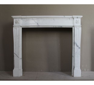 Antique Neoclassical marble mantel carved in White Calacatta with floral carving.