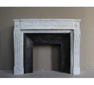 Important white veined Calacatta marble fireplace with refined floral carving.