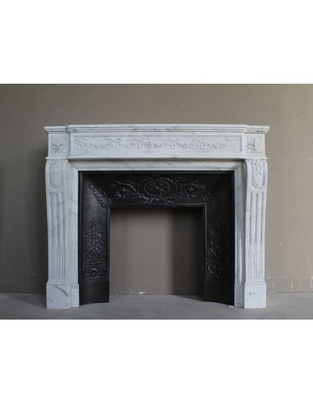 Important white veined Calacatta marble fireplace with refined floral carving.