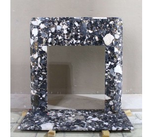 Antique Art Deco style fireplace mantel carved out of black marble with gold veins.