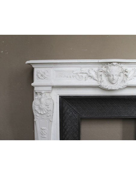 219 AG EXCEPTIONAL LOUIS XVI "TÊTE DE FEMME" FIREPLACE SURROUND CARVED IN WHITE STATUARY MARBLE