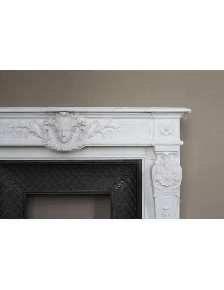 219 AG EXCEPTIONAL LOUIS XVI "TÊTE DE FEMME" FIREPLACE SURROUND CARVED IN WHITE STATUARY MARBLE
