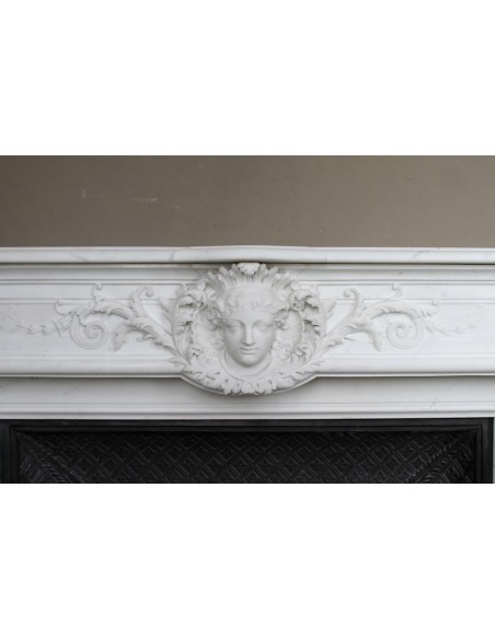 219 AG EXCEPTIONAL LOUIS XVI "TÊTE DE FEMME" FIREPLACE SURROUND CARVED IN WHITE STATUARY MARBLE