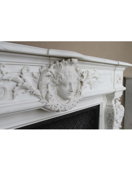 219 AG EXCEPTIONAL LOUIS XVI "TÊTE DE FEMME" FIREPLACE SURROUND CARVED IN WHITE STATUARY MARBLE