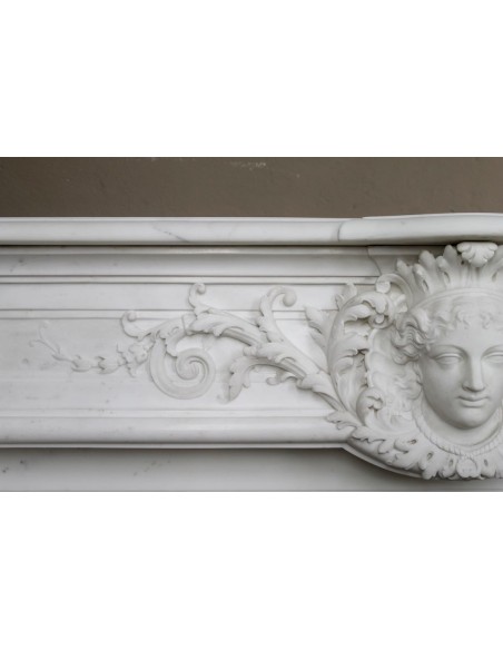 219 AG EXCEPTIONAL LOUIS XVI "TÊTE DE FEMME" FIREPLACE SURROUND CARVED IN WHITE STATUARY MARBLE