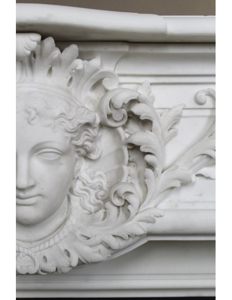 219 AG EXCEPTIONAL LOUIS XVI "TÊTE DE FEMME" FIREPLACE SURROUND CARVED IN WHITE STATUARY MARBLE