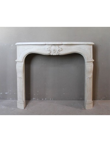 Antique fireplace carved in gilded stone, called “Pierre dorée,” of French origin and 19th century.