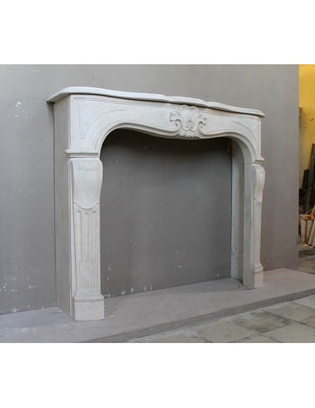905 ANTIQUE "TRANSITION" FIREPLACE MANTEL CARVED IN “PIERRE DORÉE” STONE
