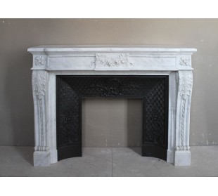 Antique exceptional Neoclassical fireplace mantel carved in white Carrara marble. This mantel has its original cast iron insert.