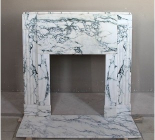 Antique Art Deco fireplace mantel carved in charming Medicean Breccia marble.