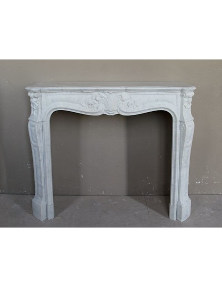 ANTIQUE AND AUTHENTIC LOUIS XV FLORAL "AMÉLIORÉ" FIREPLACE MANTEL CARVED IN WHITE CARRARA MARBLE