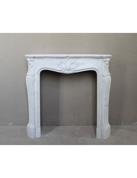 Antique very small and lovely marble fireplace mantel in Baroque style.