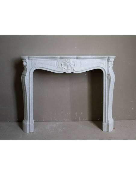 Antique White Carrara marble fireplace. This mantel is called "Three Shells" because of its decorations and sculptures.