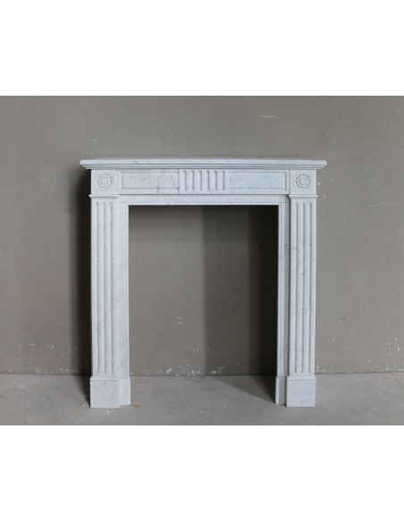 Beautiful little Neoclassical marble fireplace mantel. Antique, genuine one-of-a-kind piece.