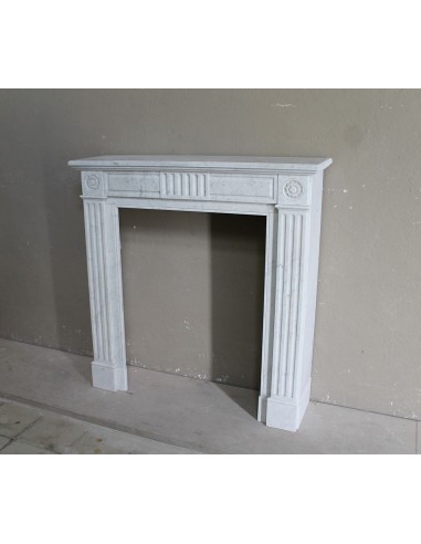 Charming Neoclassical antique fireplace in white marble, featuring refined floral sculptural details.