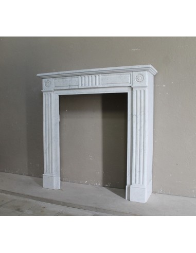 Charming Neoclassical antique fireplace in white marble, featuring refined floral sculptural details.