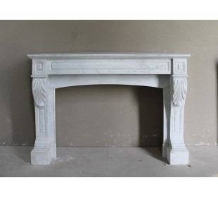 Antique white Carrara marble fireplace mantel surround.
