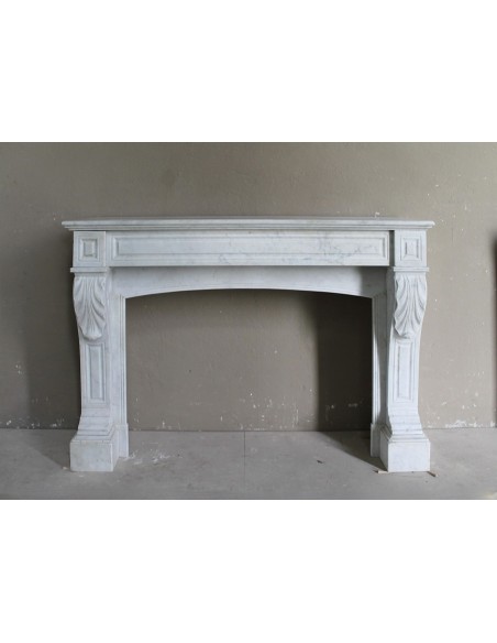 Antique white Carrara marble fireplace mantel surround.
