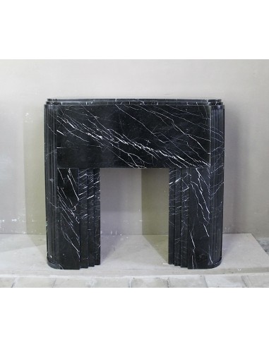 ICONIC ART DECO FIREPLACE MANTEL CARVED FROM BLACK MARQUINIA MARBLE. A ONE-OF-A-KIND MARBLE FIRE SURROUND.