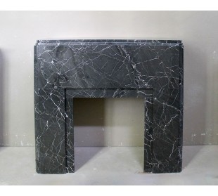 Antique authentic Art Deco marble fireplace mantel carved from Black Marquinia Gold marble.
