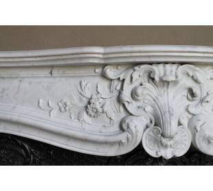 Antique white marble fireplaces with baroque and floral decorations, of various types and costs.