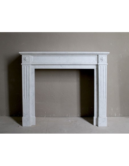 Antique white Carrara Neoclassical marble fireplace mantel.