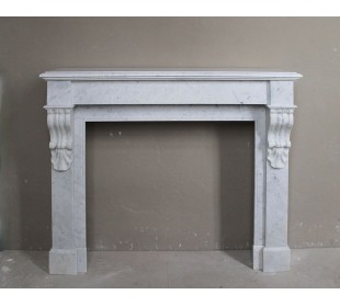 Antique fireplace carved in white Carrara marble called “Palmettes” with sober and elegant lines.