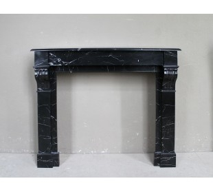 Antique "Modillon" fireplace carved in Black Marquinia marble with white veins.