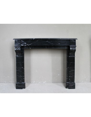 Antique "Modillon" fireplace carved in Black Marquinia marble with white veins.