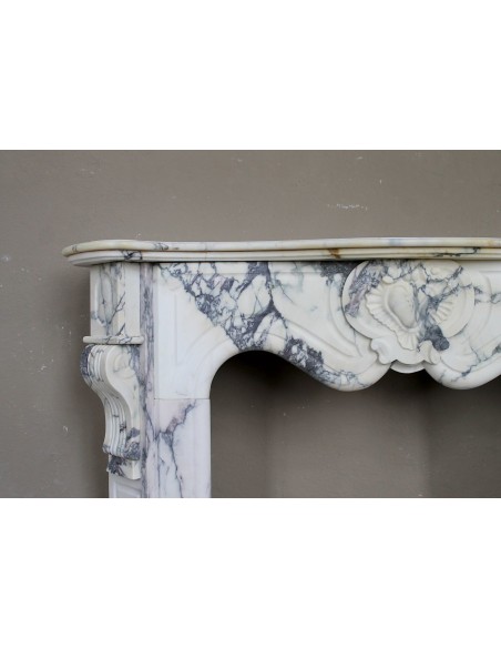 046 LOUIS XV “COEUR” FIREPLACE OF PROVENCAL STYLISM CARVED IN CHARMING BRÈCHE VIOLETTE MARBLE