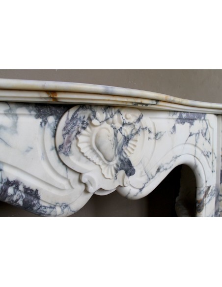 046 LOUIS XV “COEUR” FIREPLACE OF PROVENCAL STYLISM CARVED IN CHARMING BRÈCHE VIOLETTE MARBLE